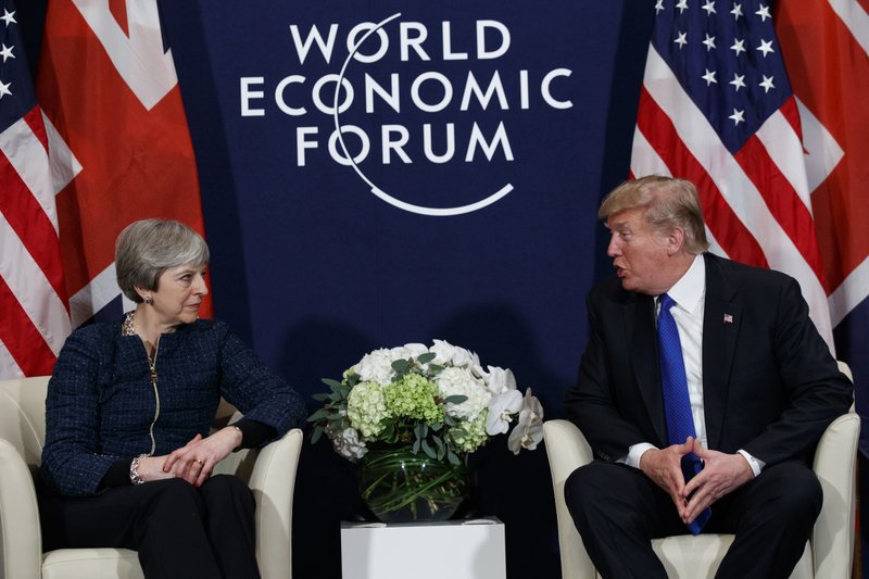 US President Donald Trump meeting with British Prime Minister Theresa May at the World Economic Forum in Davos, Switzerland. President Donald Trump has wished Prince Harry and fiancee Meghan Markle well and says he is not aware of having received an invitation to their royal wedding in May.Photo: AP
