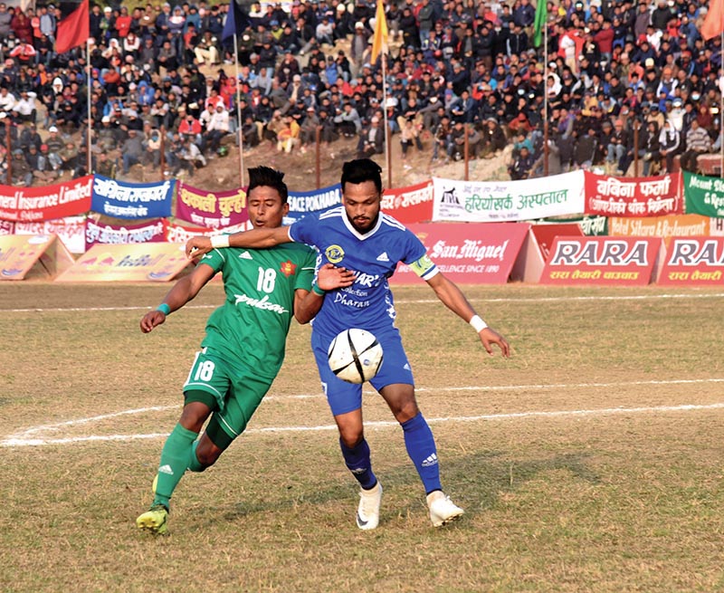 TACu2019s Nawayug Shrestha (left) vies with Dharan FC player during their 16th Aaha Rara Gold Cup match in Pokhara on Sunday. Photo Courtesy: Sudarshan Ranjit