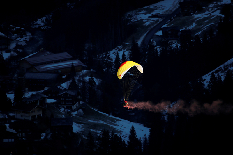 A paraglider flies in the sky before the race.  Photo: Reuters