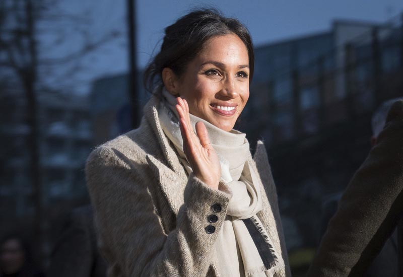 File - Meghan Markle waves to the crowd as she leaves after a visit with Britain's Prince Harry to the Reprezent 107.3 FM radio station in Brixton, south London, Tuesday, on Jan. 9, 2018. Photo: AP