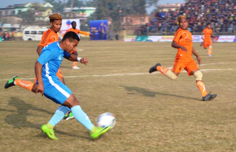 A Chyasal Youth Club player shoots the ball under pressure from Farwest Sports Club opponents during their Khaptad Gold Cup match in Dhangadhi on Friday. Photo: THT