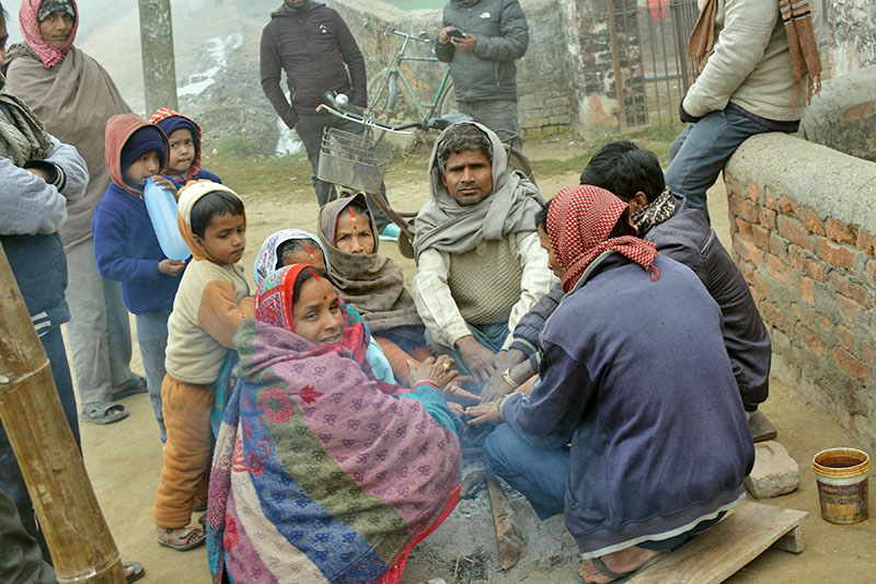 People sit around fire to keep themselves warm as mercury plummets  in Kaliya Sub-Metropolitan City in Bara district, on Sunday, January 21, 2018. Photo: RSS