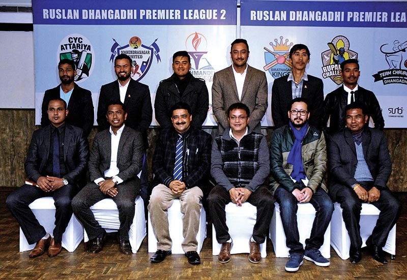 Team owners (down) and their strategic players for the second Ruslan Dhangadhi Premier League pose for a group photo at a programme in Kathmandu on Wednesday. Photo: THT