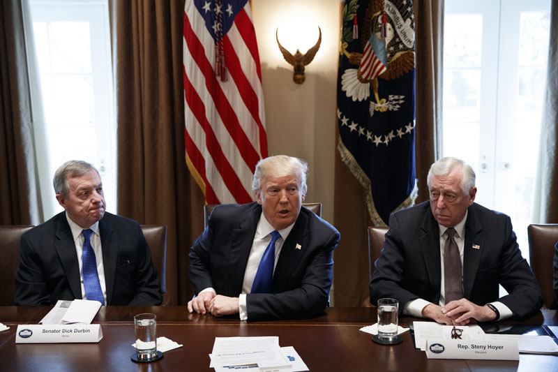 Sen. Dick Durbin, D-Ill., left, and Rep. Steny Hoyer, D-Md. listen as President Donald Trump speaks during a meeting with lawmakers on immigration policy in the Cabinet Room of the White House, Tuesday, Jan. 9, 2018, in Washington. Photo: AP