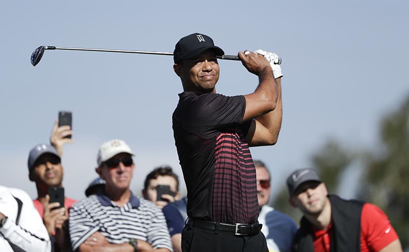 Tiger Woods watches his tee shot on the second hole hole of the South Course at Torrey Pines Golf Course during the first round of the Farmers Insurance Open golf tournament, in San Diego,Thursday, January 25, 2018. Photo: AP
