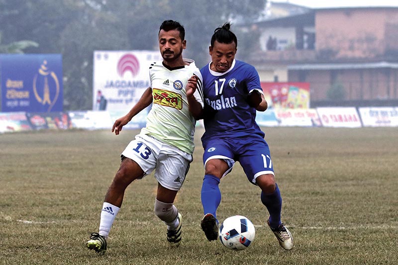 Ruslan Three Star Club's Buddha Chemjong (right) vies with a Rum Pum Jhapa-XI player during their Nepal Ice Farwest  Khaptad Gold Cup Match at the Dhangadhi Stadium in Dhangadhi on Monday. Photo: THT