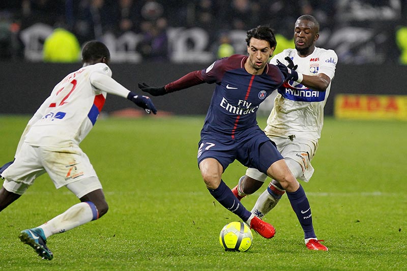 Paris Saint-Germainu2019s Javier Pastore in action with Lyon's Ferland Mendy and Tanguy Ndombele. Photo: Reuters