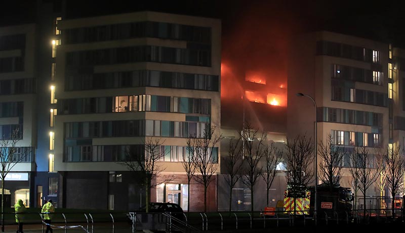 Firefighters tackle a fire during a serious blaze in a multi-storey car park in Liverpool, Britain, on December 31, 2017. Photo: Reauters