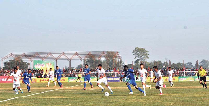 Players of Three Star Club (blue) and Nepal APF Club in action during their Madan Bhandari Memorial Itahari Gold Cup match on Saturday. Photo: THT