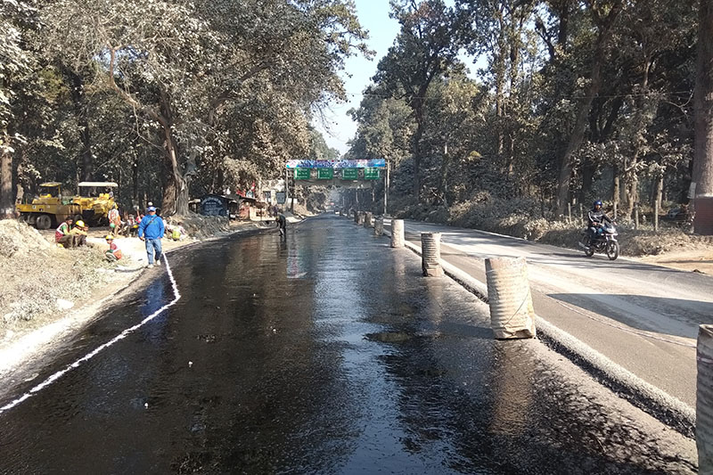 Workers preparing to blacktop a section of the Narayangadh-Muglin road stretch  in Chitwan, on Tuesday, January 2, 2017. Photo: Tilak Ram Rimal/THT