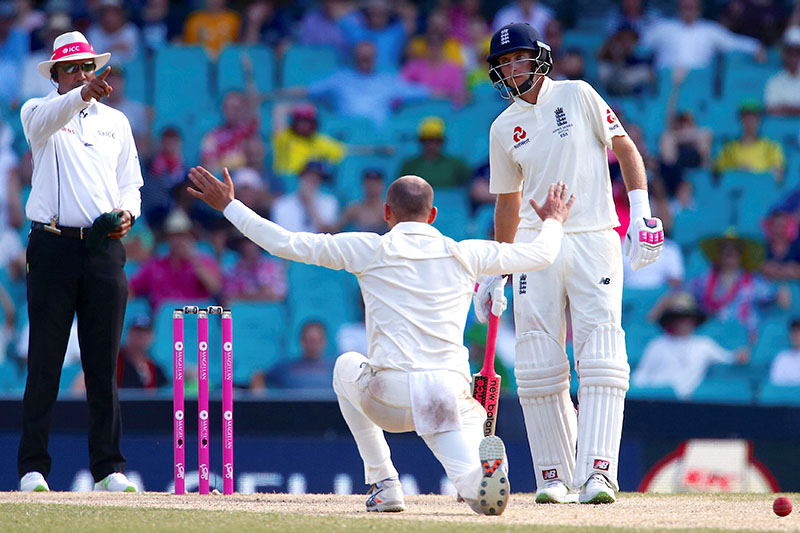 England's captain Joe Root reacts after Australia's Nathan Lyon appealed successfully for LBW to dimiss Dawid Malan during the fourth day of the fifth Ashes cricket test match. Photo: Reuters