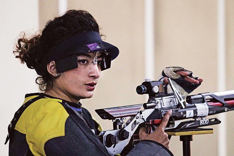 Sneha Rajya Laxmi Rana of Western Region gets ready for a shot during the 10m Air Rifle event of the National Shooting Tournament in Lalitpur on Wednesday. Photo: Udipt Singh Chhetry/ THT