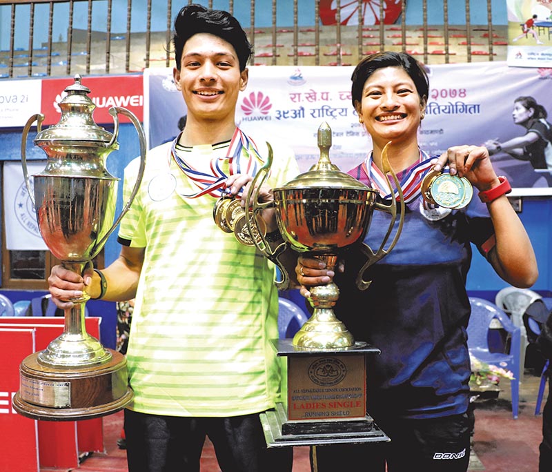 Shyantu Shrestha and Nabita Shrestha hold their trophies after the Huawei National Table Tennis Tournament under the NSC Championship in Kathmandu on Saturday. Photo: THT