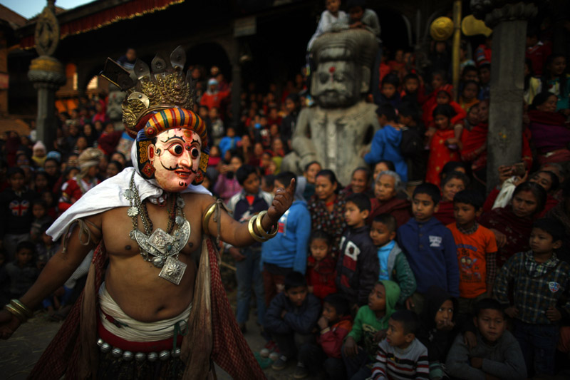 A person dressed as a deity performs the Navadurga dance during the fish killing festival in Bhaktapur, Nepal on Wednesday, January 17, 2018. The historic festival started during the Malla era around 10th to 18th century. Photo: Skanda Gautam