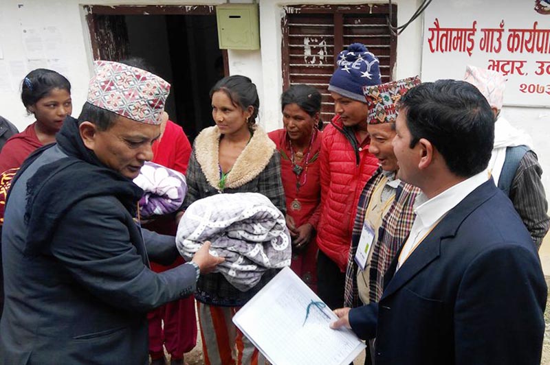 Relief materials being distributed to fire victims, in Rautamai Rural Municipality, Udayapur, on Sunday, January 21, 2018. Photo: THT