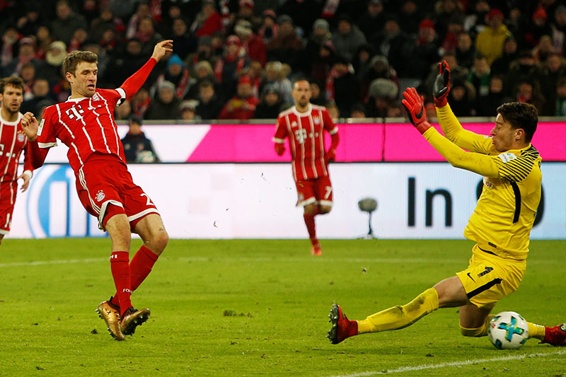 Bayern Munich's Thomas Muller scores their fourth goal. Photo: Reuters