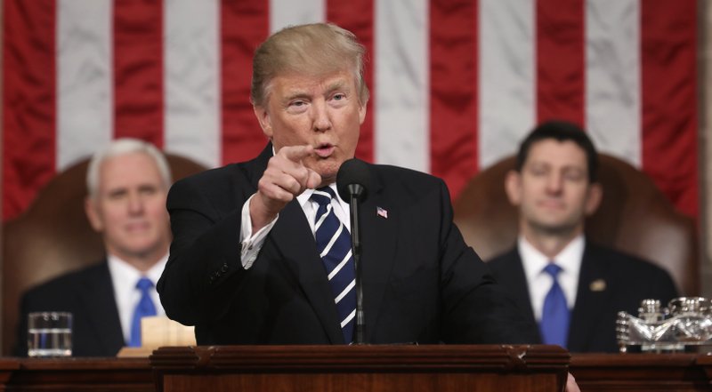 President Donald Trump addresses a joint session of Congress on Capitol Hill in Washington. as Vice President Mike Pence and House Speaker Paul Ryan of Wis. listen. Trump will deliver his first State of the Union address on Tuesday, January 30, 201. Photo: AP