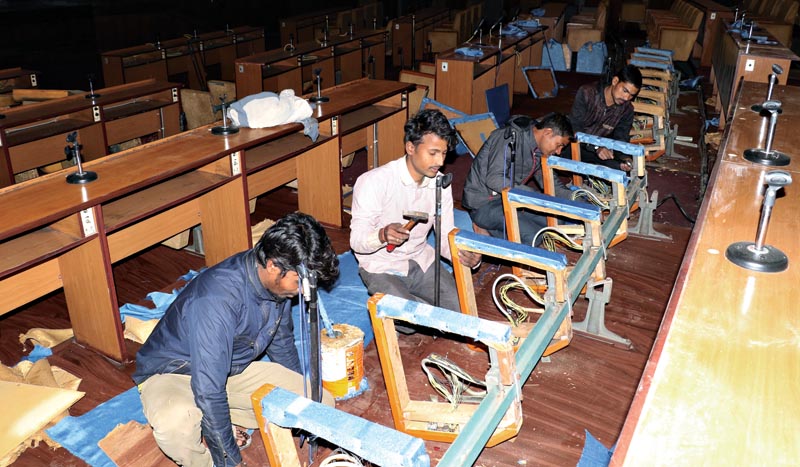 Workers setting up chairs inside the Parliament building in New Baneshwor, Kathmandu, on Wednesday.Photo: THT Print 