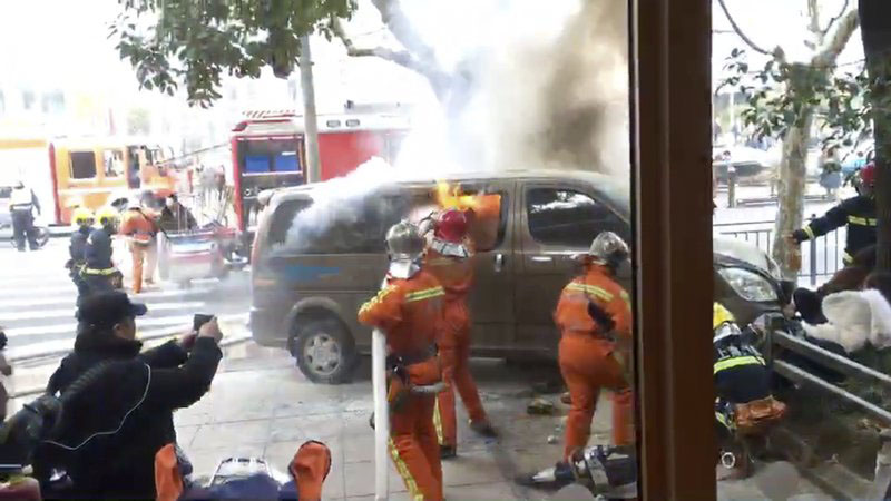 In this image taken from cellphone video provided to the Associated Press, firefighters put out a blaze after a minivan carrying gas tanks plowed into pedestrians along a street in Shanghai, Friday, Feb. 2, 2018. A minivan plowed into pedestrians on a sidewalk in downtown Shanghai on Friday, sending more than a dozen people to hospitals. Photo: AP