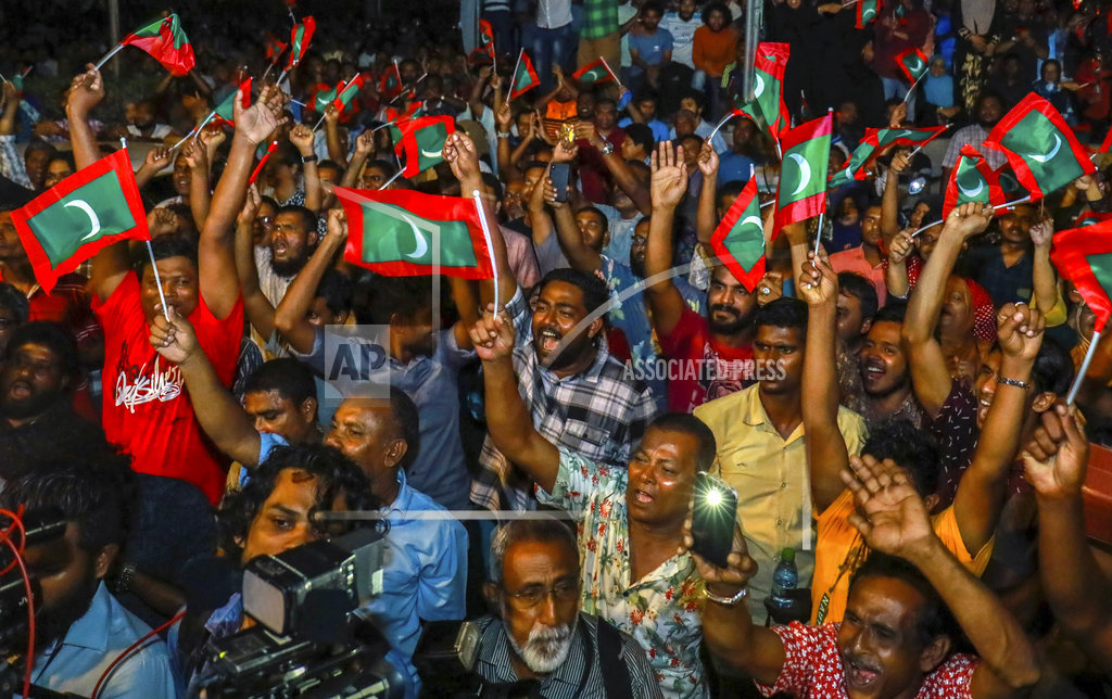 Maldivian opposition protestors shout slogans demanding the release of political prisoners during a protest in Male, Maldives, Friday, Feb. 2, 2018. Supporters of political parties that oppose the Maldives government have clashed with police on the streets of the capital after the country's supreme court ordered the release of imprisoned politicians.(AP Photo/Mohamed Sharuhaan)