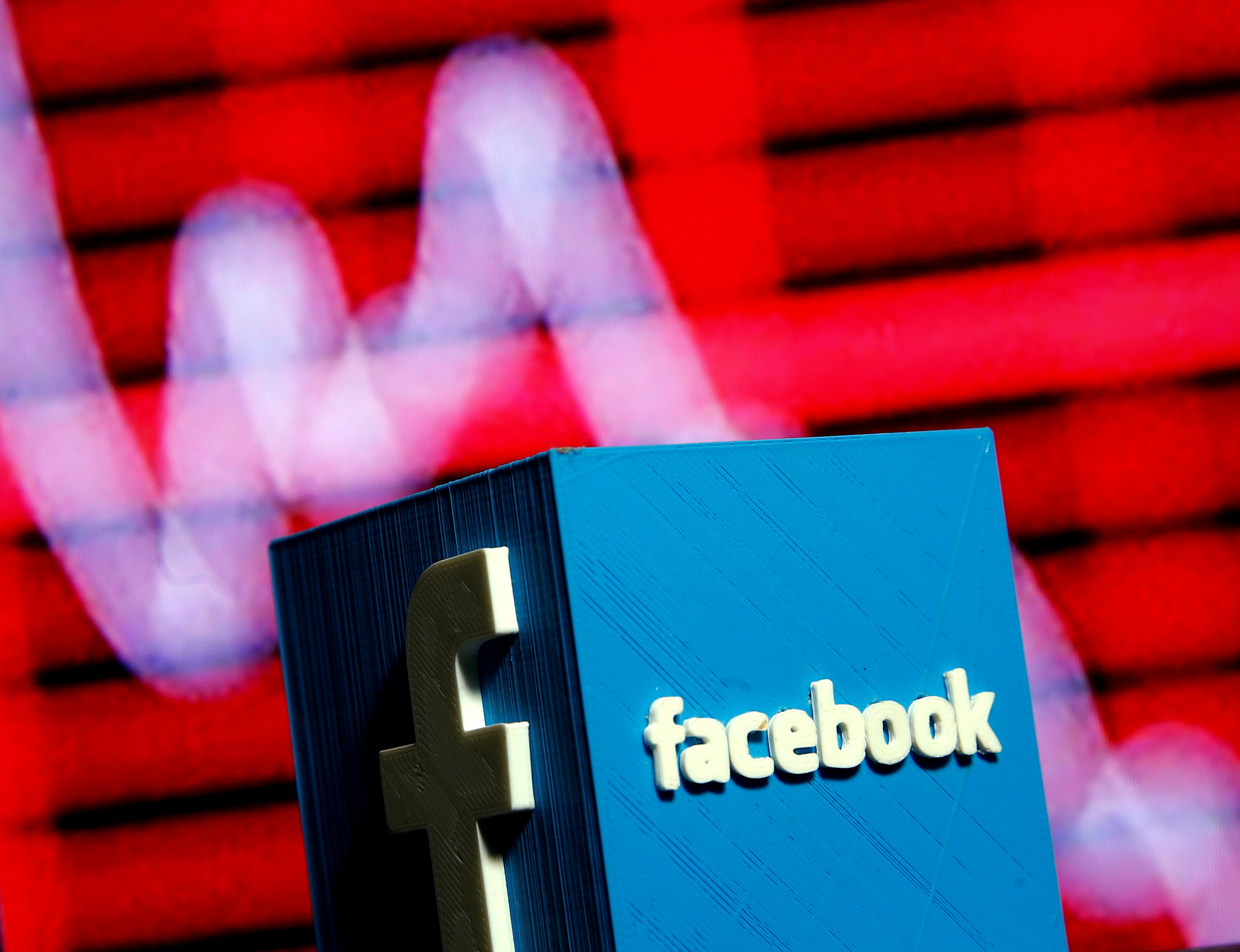 FILE PHOTO:    A 3D-printed Facebook logo is seen in front of a displayed stock graph in this illustration taken November 3, 2016.  REUTERS/Dado Ruvic/Illustration/File Photo