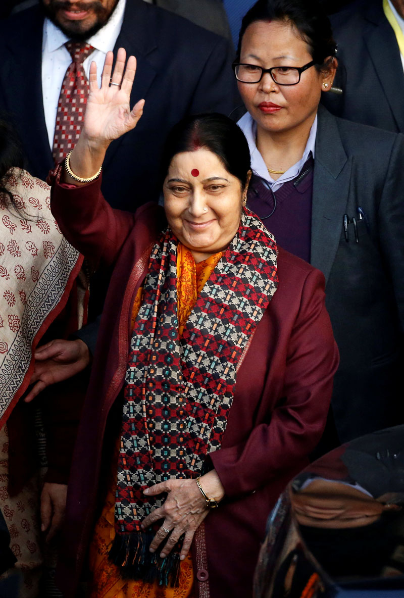 Indian Foreign Minister Sushma Swaraj waves towards the media upon her arrival at Tribhuvan International Airport in Kathmandu, Nepal February 1, 2018. Photo: Reuters