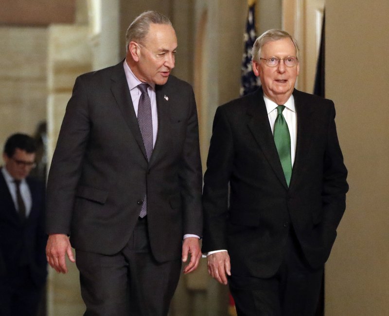 Senate Majority Leader Mitch McConnell, R-Ky., and Senate Minority Leader Chuck Schumer, D-N.Y., left, walk to the chamber after collaborating on an agreement in the Senate on a two-year, almost $400 billion budget deal that would provide Pentagon and domestic programs with huge spending increases, at the Capitol in Washington, Wednesday, Feb. 7, 2018.Photo : AP