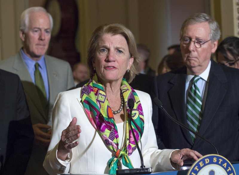 Sen. Shelly Moore Capito, R-W.Va., accompanied by Senate Majority Leader Mitch McConnell of Ky., right, and Senate Majority Whip John Cornyn of Texas, speaks on Capitol Hill in Washington. Prominent Republican women say theyu2019re frustrated by President Donald Trumpu2019s handling of abuse charges against men in the White Houseu2019s midst. Moore Capito of West Virginia says itu2019s difficult being a Republican woman and having to u201cfight throughu201d the administrationu2019s muddled message to women. Photo: AP