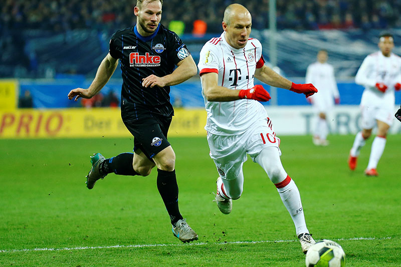 Bayern Munich's Arjen Robben in action with Paderbornu2019s Felix Herzenbruch. Photo: Reuters