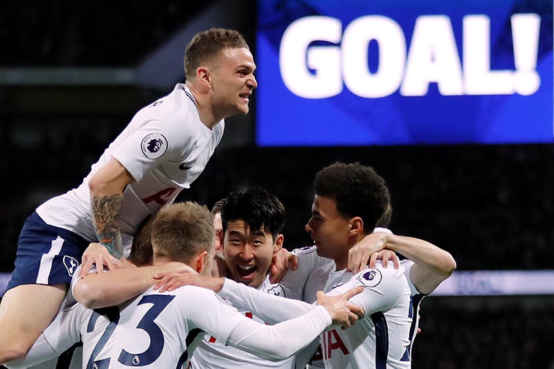 Tottenham's Christian Eriksen celebrates with team mates after scoring their first goal during the Premier League match between Tottenham Hotspur and Manchester United, at Wembley Stadium, in London, Britain, on January 31, 2018. Photo: Reuters