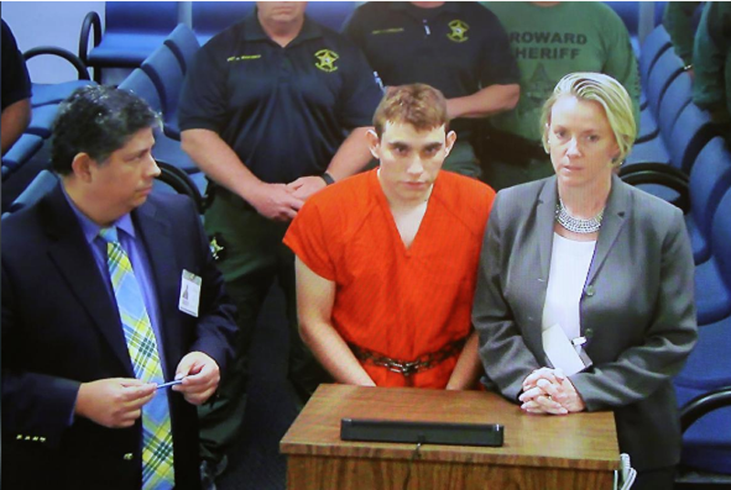Nikolas Cruz (C) appears via video monitor with Melisa McNeill (R), his public defender, at a bond court hearing after being charged with 17 counts of premeditated murder, in Fort Lauderdale, Florida, US on February 15, 2018. Photo: Reuters 