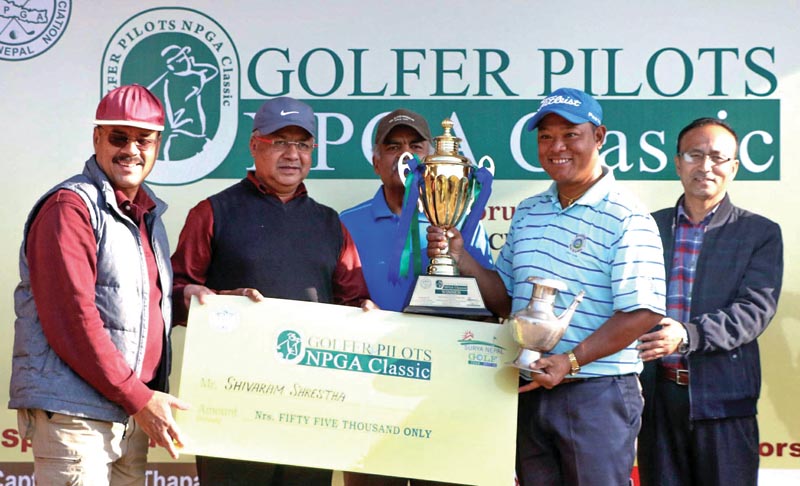 Shivaram Shrestha receives the trophy and cheque after winning the Golfer Pilots NPGA Classic at the Gokarna Golf Club in Kathmandu on Friday, February 9, 2018. Photo: THT