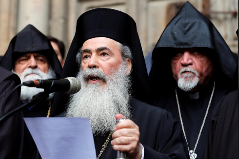 Greek Orthodox Patriarch of Jerusalem, Theophilos III, speaks during a news conference with other church leaders in front of the closed doors of the Church of the Holy Sepulchre in Jerusalem's Old City, February 25, 2018. Photo: Reuters 