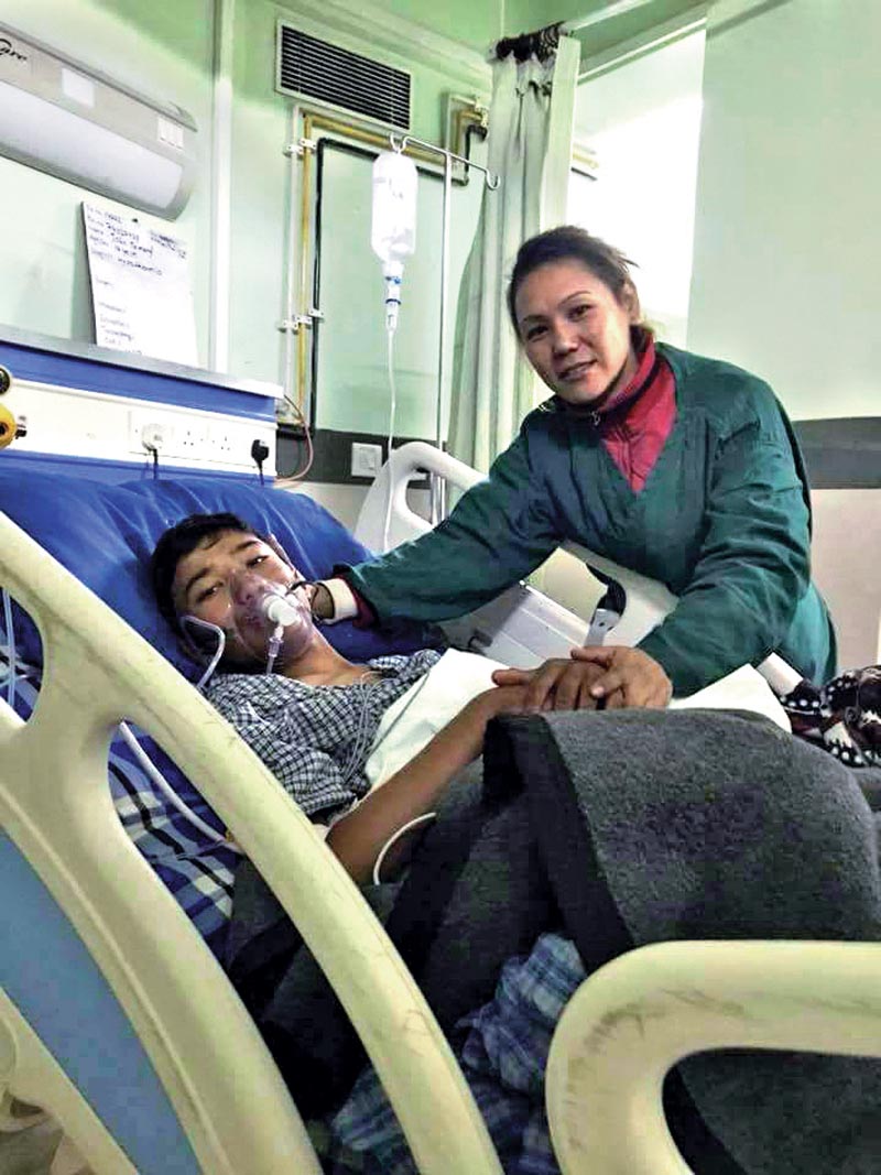 John Tamang receiving treatment in a hospital, in Lalitpur, on Thursday. Photo: THT