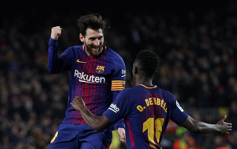 Barcelona's Lionel Messi celebrates scoring their third goal with Ousmane Dembele during the La Liga Santander match between FC Barcelona and Girona, at Camp Nou, in Barcelona, Spain, on February 24, 2018. Photo: Reuters