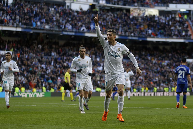 Real Madrid's Cristiano Ronaldo celebrates after scoring the opening goal against Alaves during the Spanish La Liga soccer match between Real Madrid and Alaves at the Santiago Bernabeu stadium in Madrid, on Saturday, February 24, 2018. Photo: AP