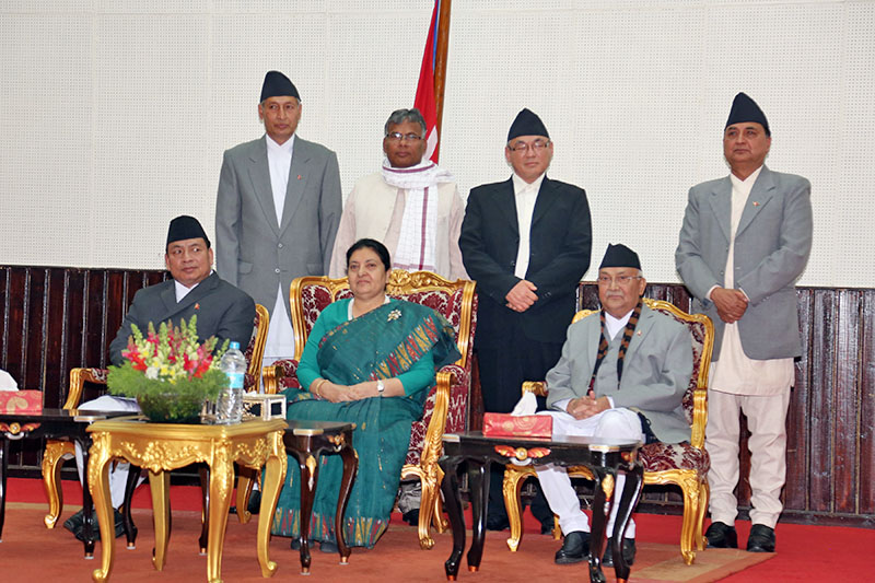 President Bidya Devi Bhandari (centre), Vice President Nanda Bahadur Pun (left), PM KP Sharma Oli along with newly appointed ministers poses for a portrait after sworn-in programme in Sheetal Niwas, Kathmandu, on Monday, February 26, 2018. Photo: RSS
