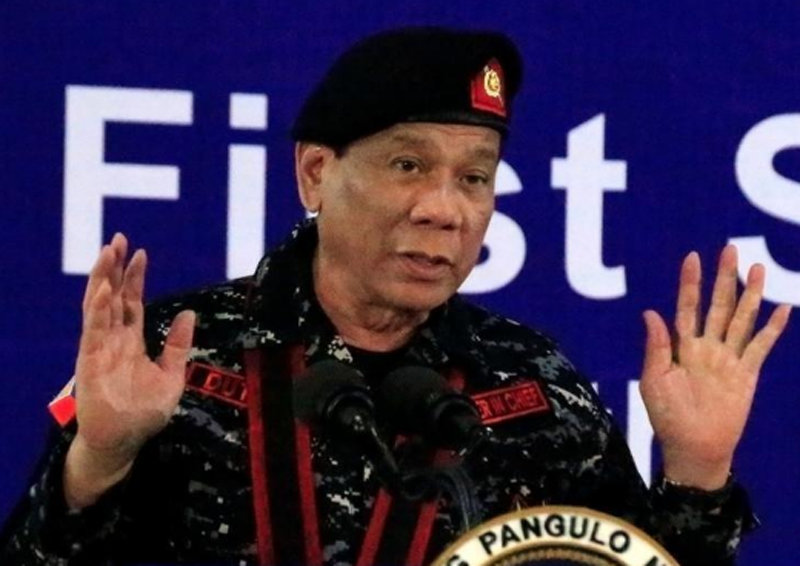 FILE-Philippine President Rodrigo Duterte, wearing a military uniform, gestures as he delivers a speech during the 67th founding anniversary of the First Scout Ranger regiment in San Miguel town, Bulacan province, north of Manila, Philippines November 24, 2017. Photo: Reuters