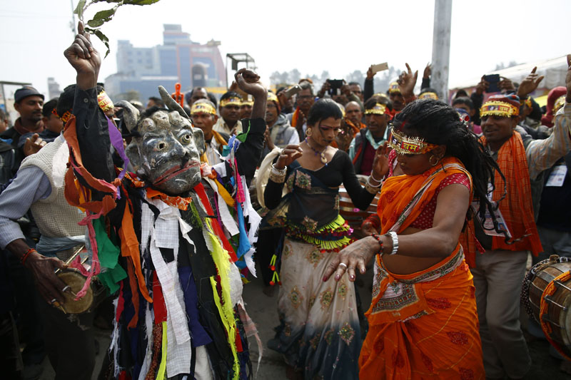 Devotees of Lord Shiva dance and sing on the eve of Mahashivaratri festival inside Pashupatinath Temple in Kathmandu, on Monday, February 12, 2018. Thousands of sadhus from Nepal and India come to celebrate the festival of Mahashivaratri by smoking marijuana, smearing their bodies with ash and offering prayers to the Hindu Deity Lord Shiva. Photo: Skanda Gautam