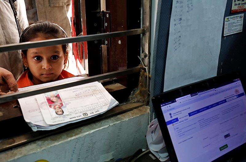 A girl waits for her turn to enrol for the Unique Identification (UID) database system, also known as Aadhaar, at a registration centre in New Delhi, India, on January 17, 2018. Photo: Reuters