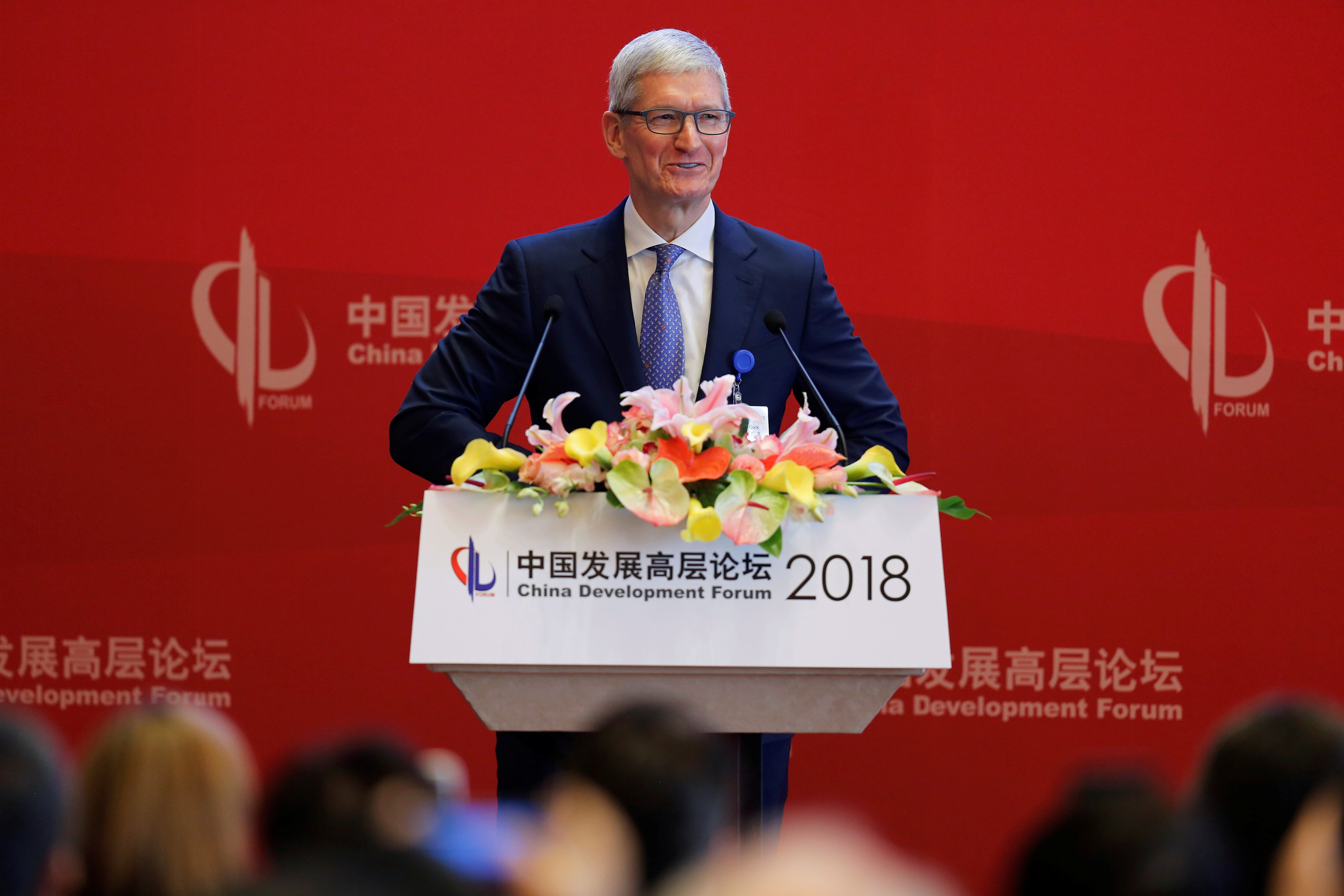 Apple Inc's Chief Executive Officer Tim Cook speaks at the China Development Forum in Beijing, China March 24, 2018. REUTERS/Stringer ATTENTION EDITORS - THIS IMAGE WAS PROVIDED BY A THIRD PARTY. CHINA OUT.