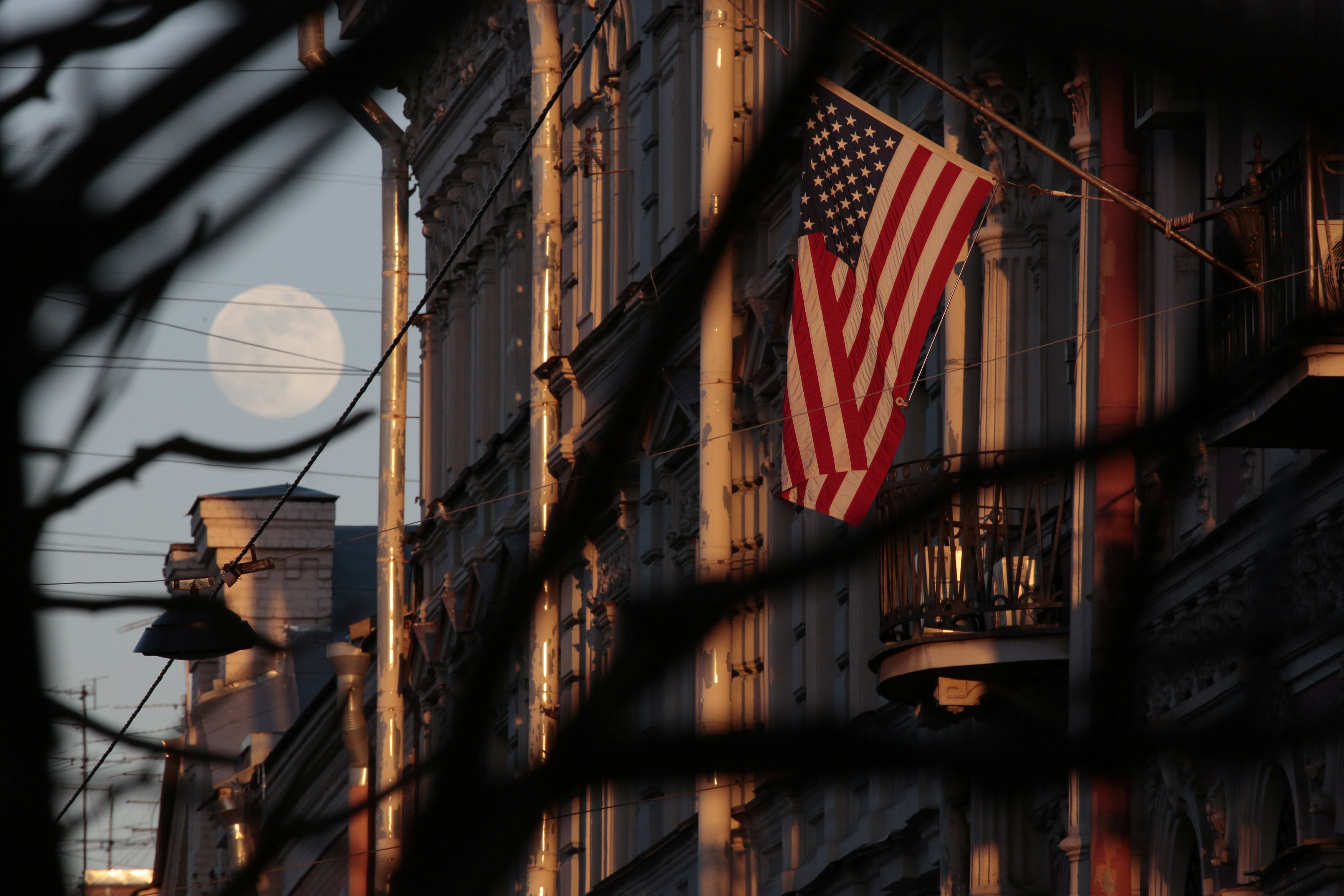 The full moon rises in the sky next to the U.S. Consulate General in St. Petersburg, Russia March 30, 2018. REUTERS/Anton Vaganov     TPX IMAGES OF THE DAY