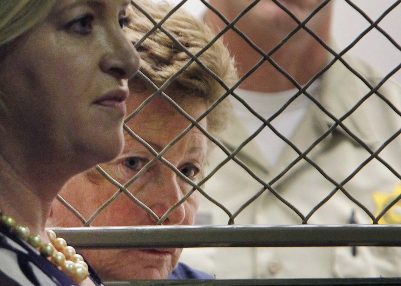 Lois Goodman with her attorney, Allison Triessl, left, during an arraignment on murder charges in Los Angeles. A Los Angeles tennis umpire arrested before a US Open match and charged in her elderly husbandu2019s 2012 death is trying to clear her name. Lois Goodmanu2019s attorneys are expected to tell jurors Wednesday, March 21, 2018. Photo: AP
