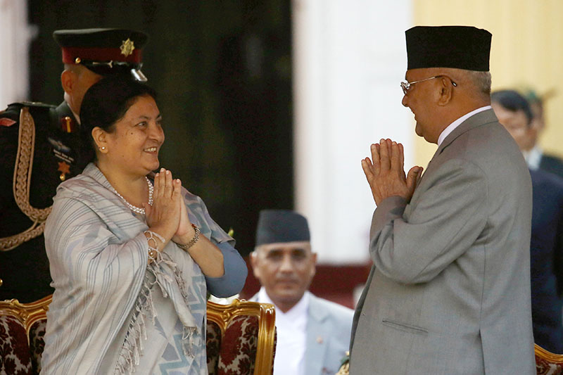 Newly elected Nepalese President Bidhya Devi Bhandari greets Prime Minister Khadga Prasad Sharma Oli, also known as K.P. Oli, after taking an oath of office at the presidential building Shital Niwas in Kathmandu, Nepal, March 14, 2018. Photo: Reuters