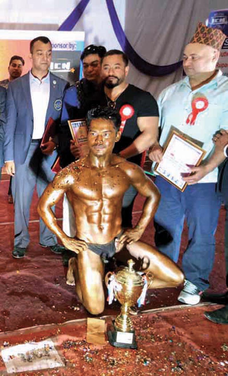 Sumit  Rana poses with the trophy of the first Buddha Classic Lumbini Bodybuilding Tournament on Sunday. Photo: THT