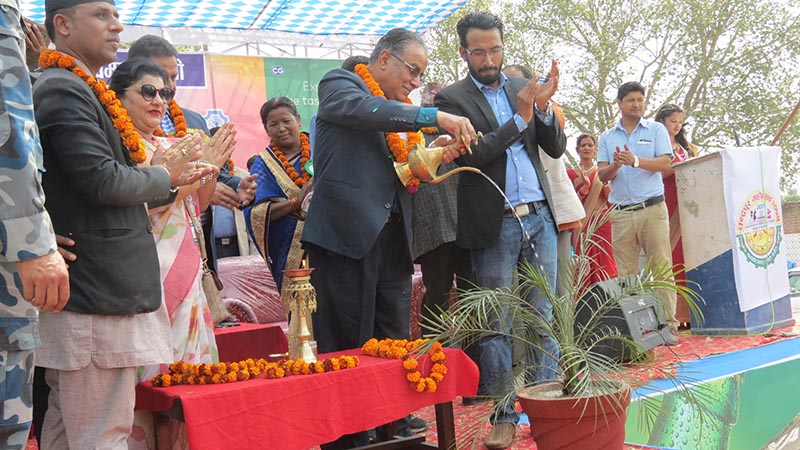CPN-Maoist Centre Chairman Pushpa Kamal Dahal inaugurating Chandrapur festival by watering a plant in Chandrapur Municipality, Rautahat, on Monday, March 12, 2018. Photo: THT