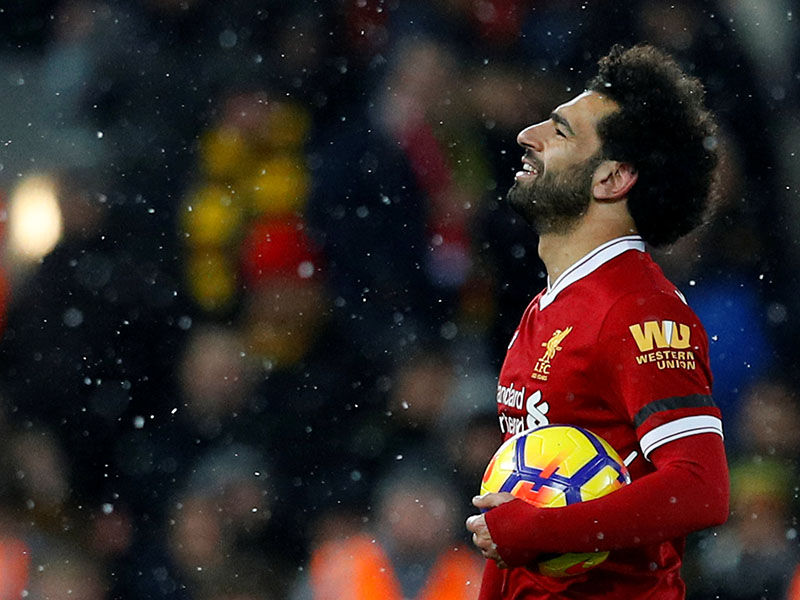 Liverpool's Mohamed Salah celebrates with the matchball after the Premier League match between Liverpool and Watford, at Anfield, Liverpool, Britain, on March 17, 2018. Photo: Reuters