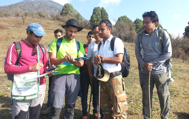 Officials conduct a study to construct an alternative route along the Birethati-Tadapai road in Kaski, on Monday, March 5, 2018. Photo: Rup Narayan Dhakal