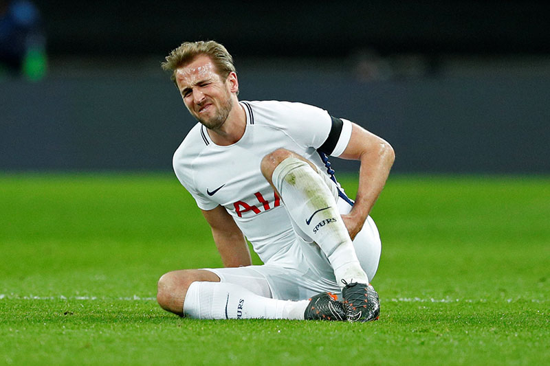 Tottenham's Harry Kane reacts as he holds his leg. Photo: Reuters