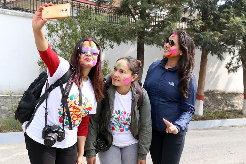 Revellers pose for a selife after celebrating Holi festival in Kathmandu, on Thursday, March 01, 2018. Photo: RSS